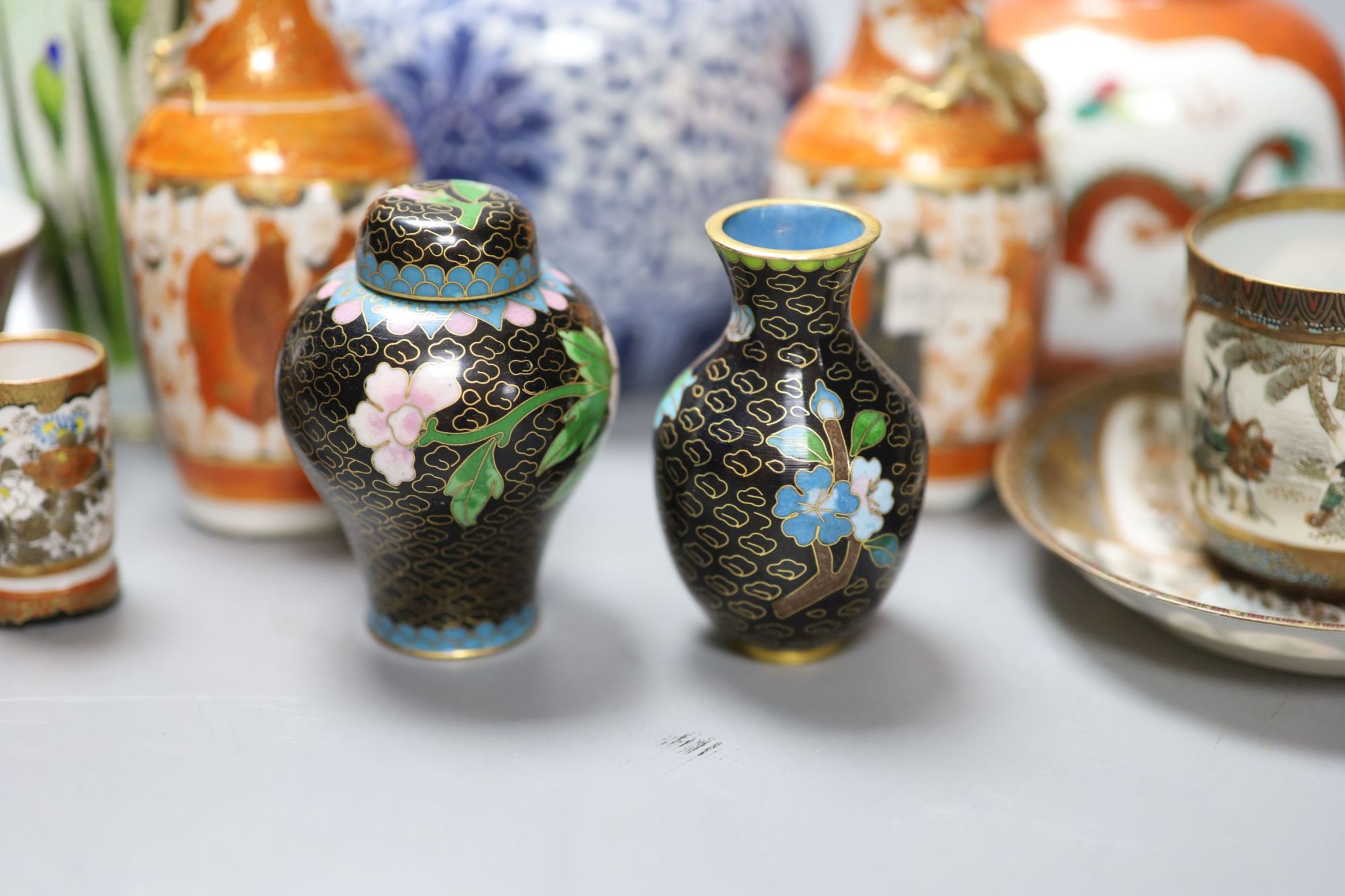 A group of Chinese and Japanese ceramics and three cloisonne enamel vases